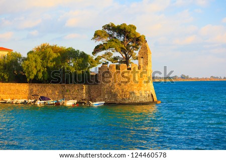 Greece Nafpaktos port with Venetcia lighthouse in ports entrance, Central Greece