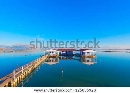 Greece amazing view in lake at Winter time, house on lake with reflection Tourlida Greece