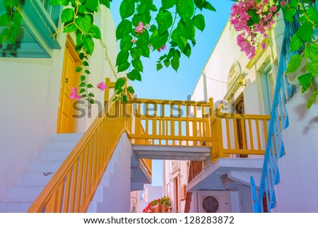 Greece Mykonos, wooden bridge connecting houses over narrow street