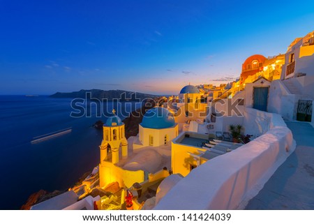 Greece Santorini island in Cyclades,  wide view of white washed colorful houses at night