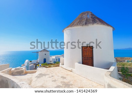 Greece Santorini island in Cyclades,  beautiful  wide view of windmills above the sea of caldera