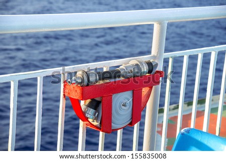 Fire extinguishing pipe with sea background on a cruise ship
