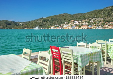 greece ithaki island, traditional greek tavern view by the sea with wooden chairs at ithaka island at summer