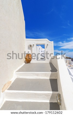Greece Santorini island in cyclades traditional view of white steps in thira by narrow walk paths at summer daylight