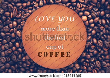 Quote about coffee on wood background over coffee beans. Coffee beans background.