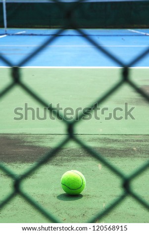 Metal mesh with tennis ball and court