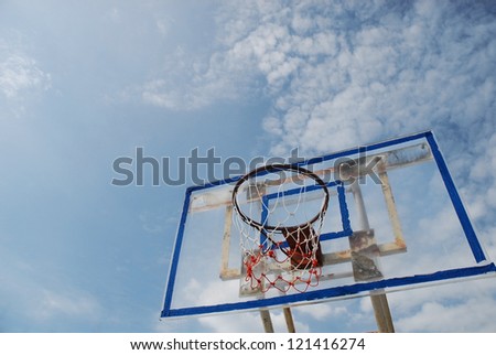 Old acrylic basketball  board with a  blue sky  background