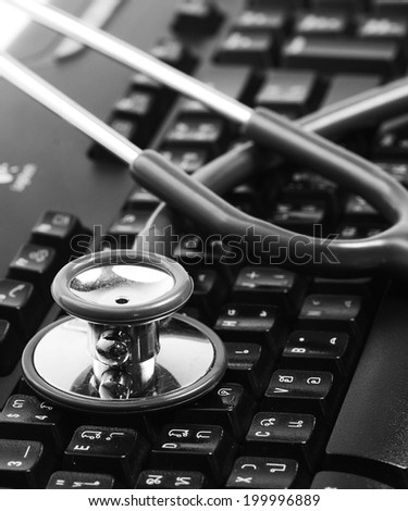 Stethoscope on keyboard background