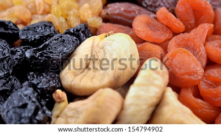 Various dried fruits  (apricots, dates, raisins, figs, prunes) close-up