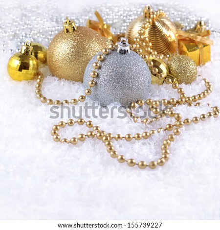 Golden and silver  Christmas decorations on a white background