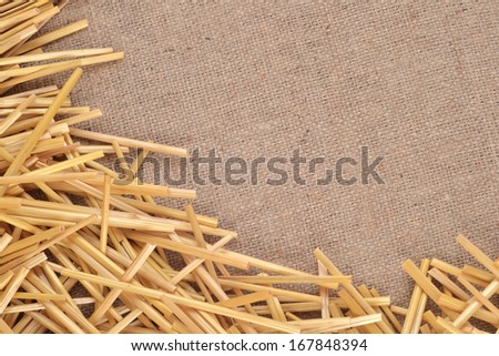 Straw on burlap as background texture