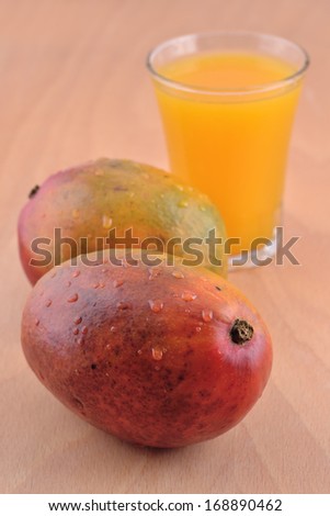 Mango and a glass of mango juice