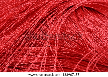 Red threads close-us as background texture