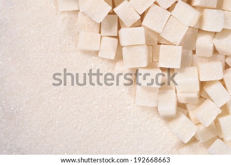 White granulated and refined sugar as background texture