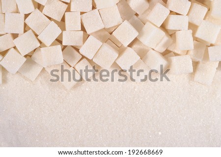 White granulated and refined sugar as background texture