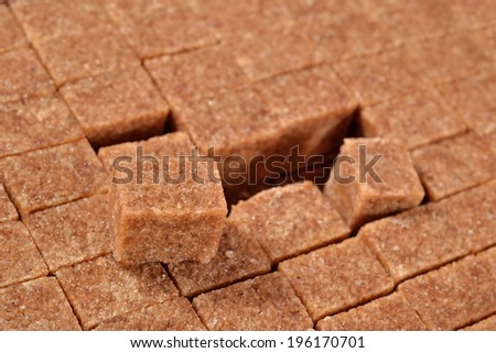 Brown refined sugar as background texture