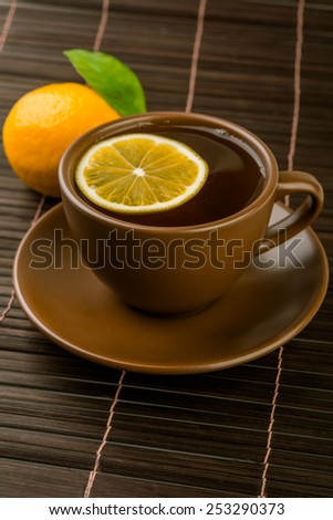 Ceramic cup of tea with mint and lemon