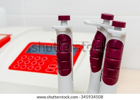 Workplace for the biomedical diagnostic. Laboratory analysis. Automatic pipettes close up.