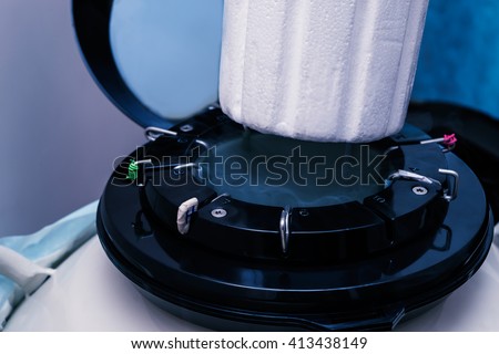 A Liquid Nitrogen bank containing sperm and eggs samples. Cryostorage of sperm samples. High tech lab equipment used in the in vitro fertilization process.