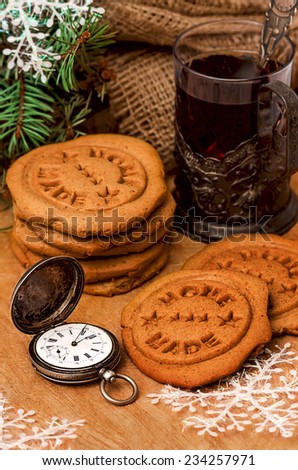 Gingerbread christmas cookies, vintage swiss watch, tea