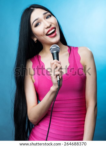 singing young woman with  microphone