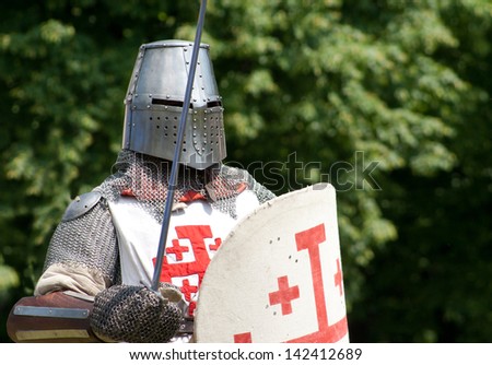 knight with sword and shield going into the duel
