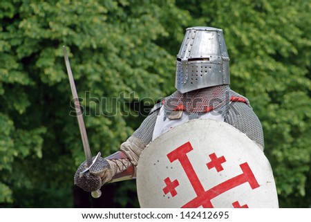 knight with sword and shield going into the duel