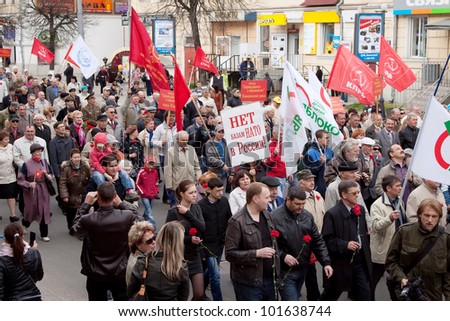 VLADIMIR, RUSSIA - MAY 1: Citizens are participating in the march of International Workers\' Day event May 1, 2012 in Vladimir, Russia. Workers and opposition group walks in main street