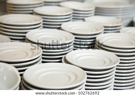Many  white different plates stacked together