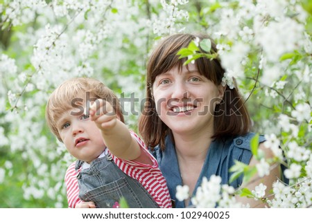Happy family  in spring blossoming garden