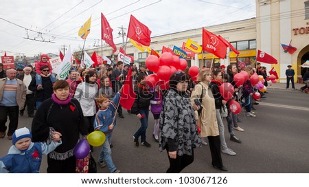 VLADIMIR, RUSSIA - MAY 1: Citizens are participating in the march of International Workers\' Day event May 1, 2012 in Vladimir, Russia. Workers and opposition group walks in main street