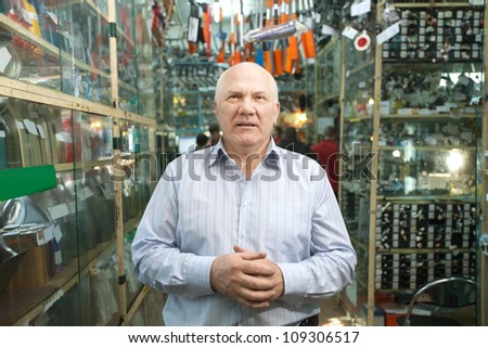 Mature manager  in  auto parts store