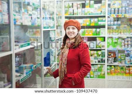 Woman near counter in pharmacy drugstore