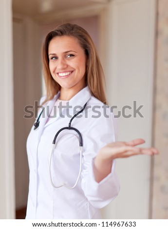 Portrait of friendly doctor in clinic interior
