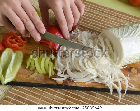 Slicing of pepper and Green goods on a cook-table