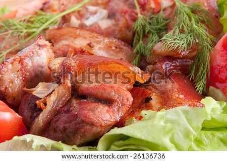 Stewed meat meat and tomatoes on Green leave