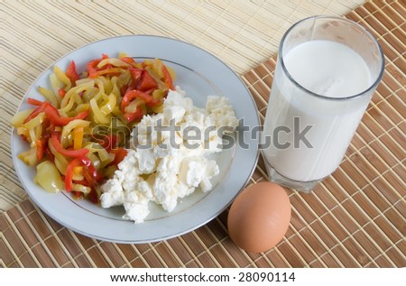 fresh vegetables, cheese and milk  on a cook-table