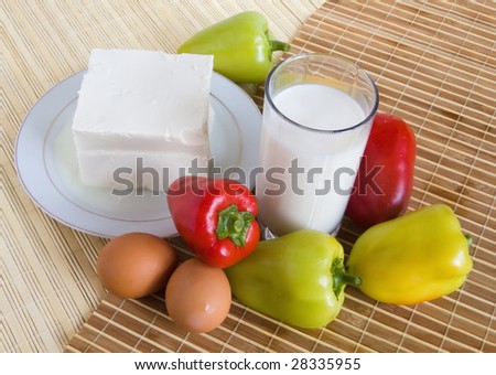 fresh vegetables, cheese and milk  on a cook-table