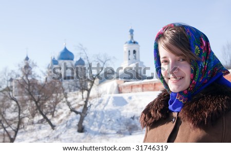 girl in russian traditional clothes  against  Russian landscape