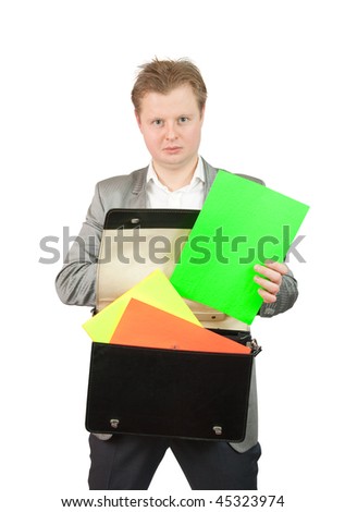 Businessman putting blank colored papers into brief case  over white