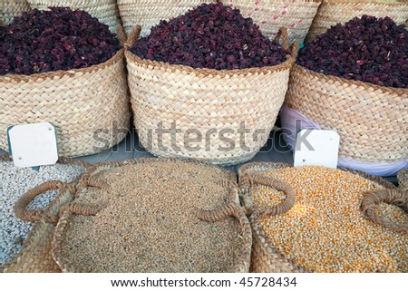 Spices and tea in baskets in orient market of spice