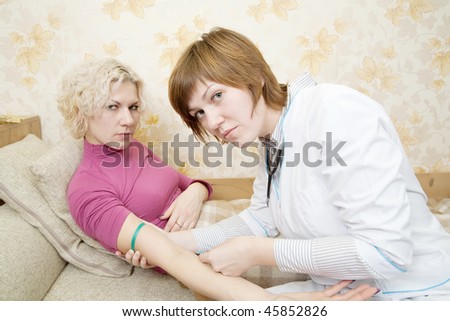 Doctor giving a girl an intravenous injection in arm