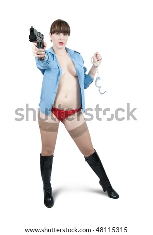 Sexy girl with gun and manacles over white, Focus on gun only