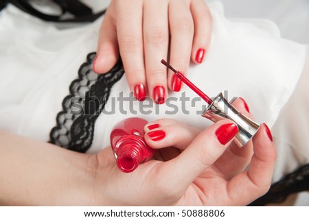 Closeup of Woman hand with nail varnish