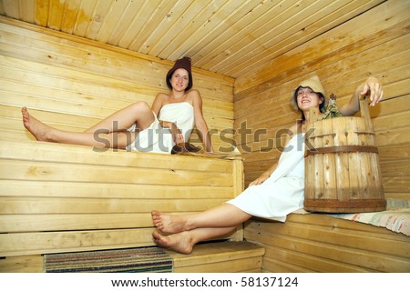 Young girls taking steam bath at sauna