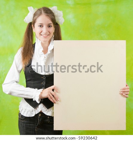 long-haired girl in school outfit  holding  blank canvas over green background