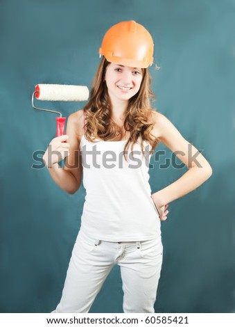 female house painters with paint rollers over grey background