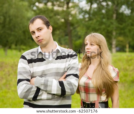 young couple after quarrel outside. Focus on man only