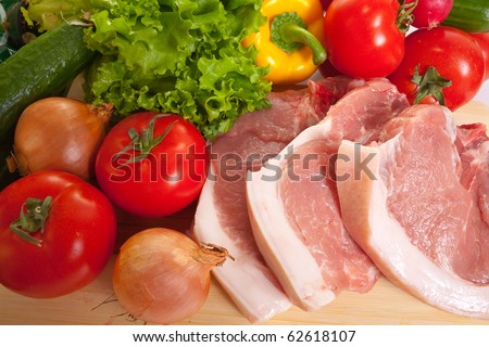 Raw meat and  spring fresh and ripe vegetables