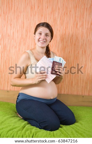 9 months pregnant woman with  birthing certificate
